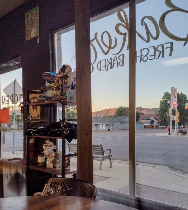 Sunrise view from inside Black Sheep Coffee, with local goods on display