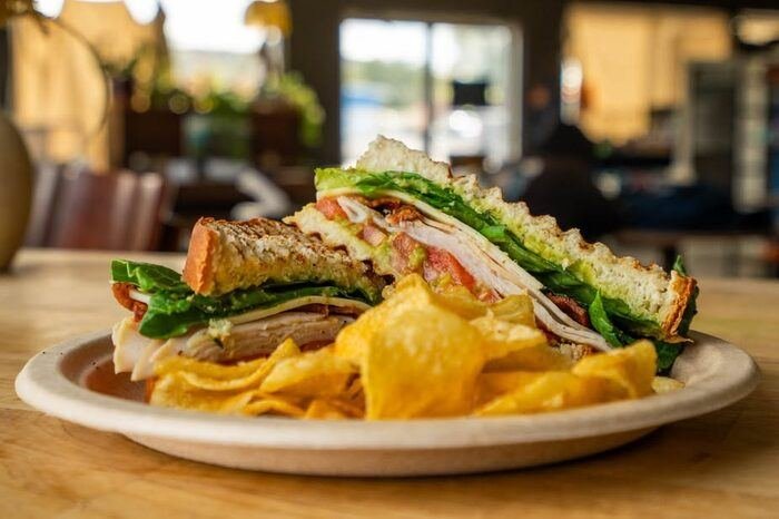 Turkey club sandwich with chips