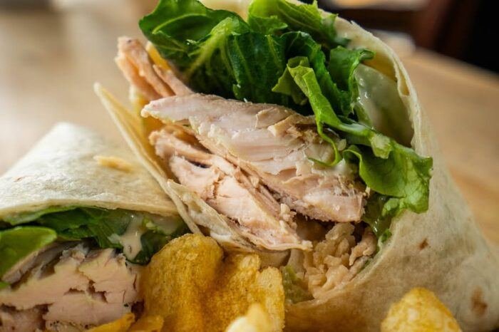 Chicken wrap close-up with chips