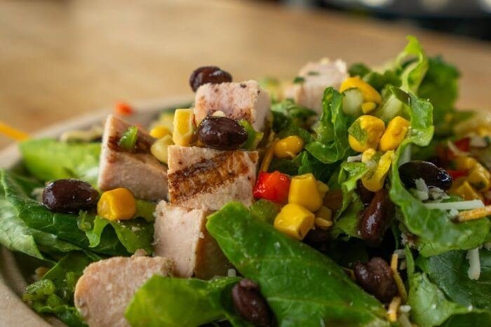 Southwest salad with chicken, corn, and black beans, close-up