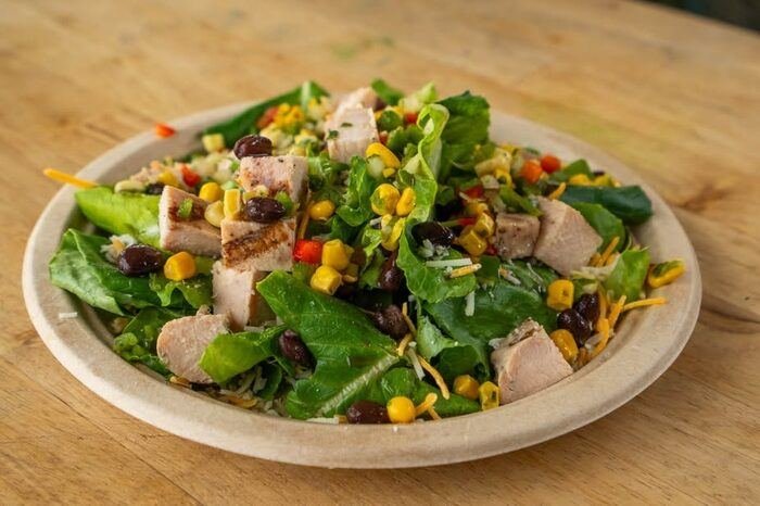 Southwest salad with chicken, corn, and black beans, wide shot