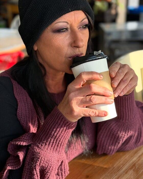 Customer enjoying a coffee at Black Sheep Coffee